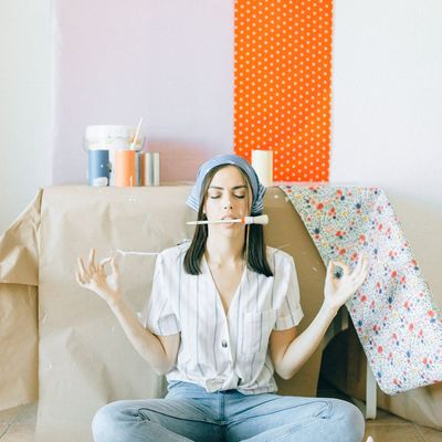An empty, clean yoga mat on a light-colored floor.